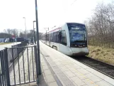 Aarhus light rail line L1 with low-floor articulated tram 2102-2202 at Hessel (2025)