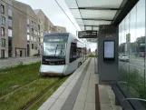 Aarhus light rail line L2 with low-floor articulated tram 2102-2202 at Stockholmsgade (2024)