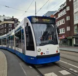 Amsterdam tram line 13 with low-floor articulated tram 2015 at Nieuwezijds Kolk (2021)
