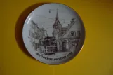 Decorative plate: Odense Hovedlinie with railcar 8 on Sankt Knuds Kirkestræde (1974)