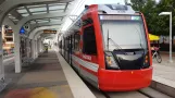 Houston tram line Purple with low-floor articulated tram 338 at EaDo/Stadium (2018)