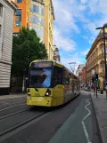 Manchester tram line Purple with articulated tram 3053 in the intersection Cross St/St. Ann (2022)