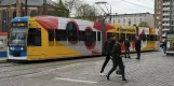 Rostock tram line 1 with low-floor articulated tram 653 on Neuer Markt (2023)