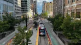 Salt Lake City regional line 704 Green Line with articulated tram 1176 on Main St (2022)