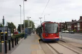 Sheffield tram line Yellow with low-floor articulated tram 102 at Middlewood (2011)