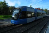 Stockholm tram line 12 Nockebybanan with low-floor articulated tram 433 on Alviksvägen (2011)