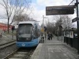 Stockholm tram line 30 Tvärbanan with low-floor articulated tram 405 at Linde (2019)