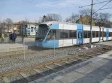 Stockholm tram line 30 Tvärbanan with low-floor articulated tram 411 at Årstaberg (2019)