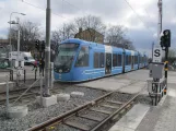 Stockholm tram line 30 Tvärbanan with low-floor articulated tram 460 at Årstaberg (2019)