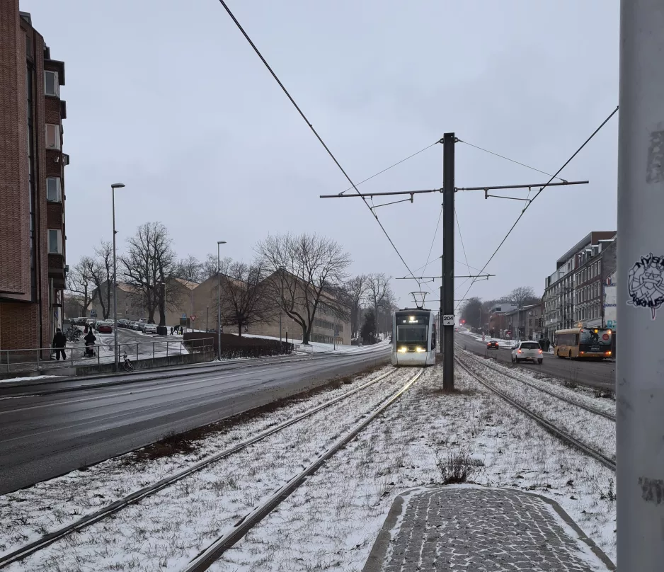 Aarhus light rail line L2 with low-floor articulated tram 2102-2202 near Nørreport (2021)