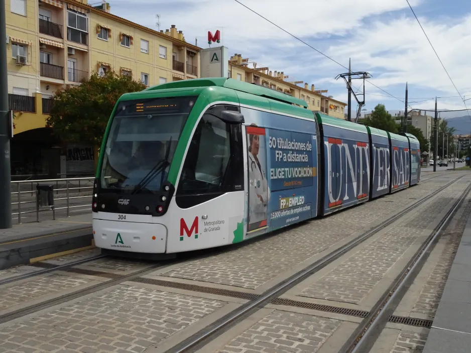 Granada tram line M1 with low-floor articulated tram 304 at Estación Autobuses (2024)