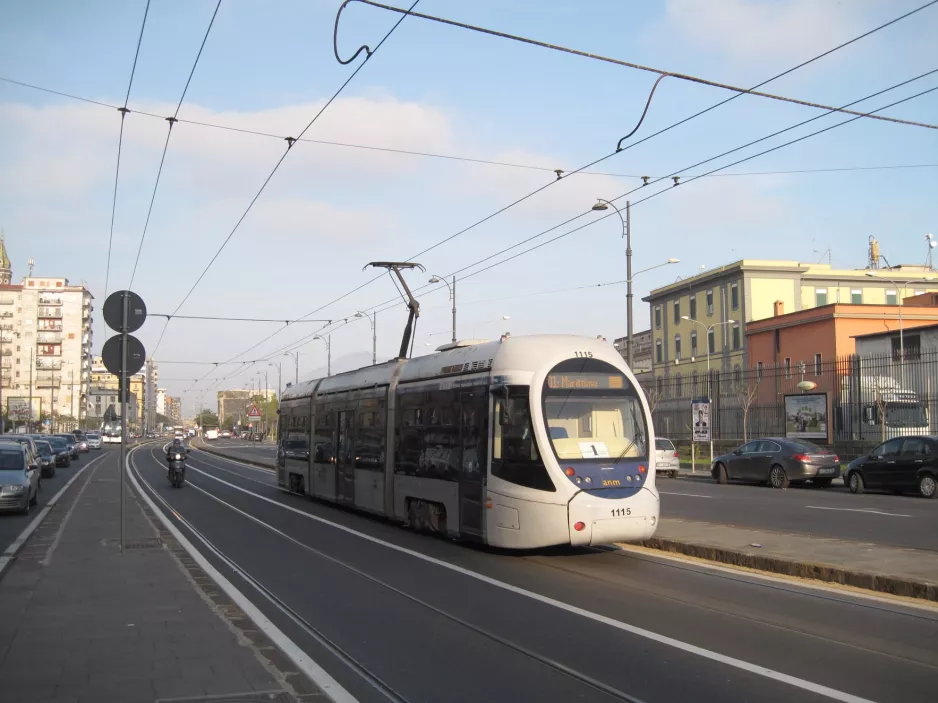 Naples tram line 1 with low-floor articulated tram 1115, the back Via Amerigo Vecpucci (2014)