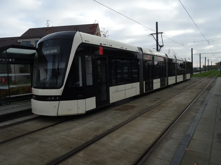 Odense Tramway with low-floor articulated tram 11 "Hjemkomsten" at Hjallese St (2024)