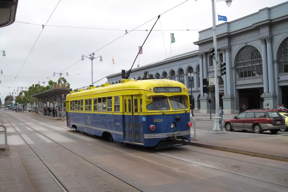 San Francisco F-Market & Wharves with railcar 1010, the back Embarcadero & Ferry Building (2010)