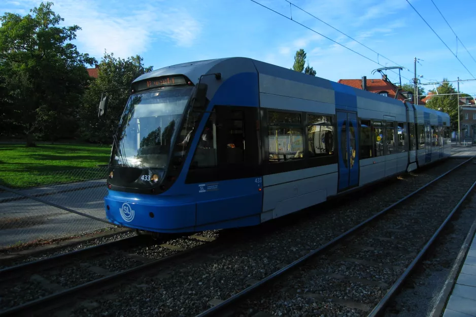 Stockholm tram line 12 Nockebybanan with low-floor articulated tram 433 close by Alléparken (2011)