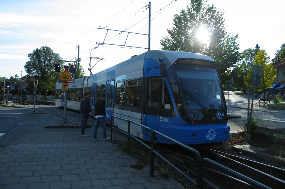 Stockholm tram line 12 Nockebybanan with low-floor articulated tram 436 close by Alléparken (2011)