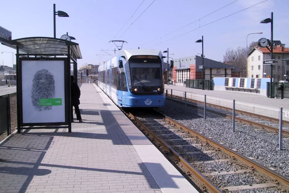 Stockholm tram line 30 Tvärbanan with low-floor articulated tram 416 at Årstafältet (2003)