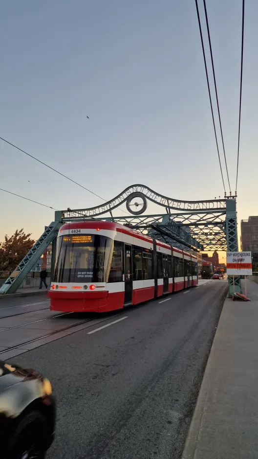 Toronto extra line 503 Kingston Rd with low-floor articulated tram 4434 on Time and a Clock Bridge (2024)