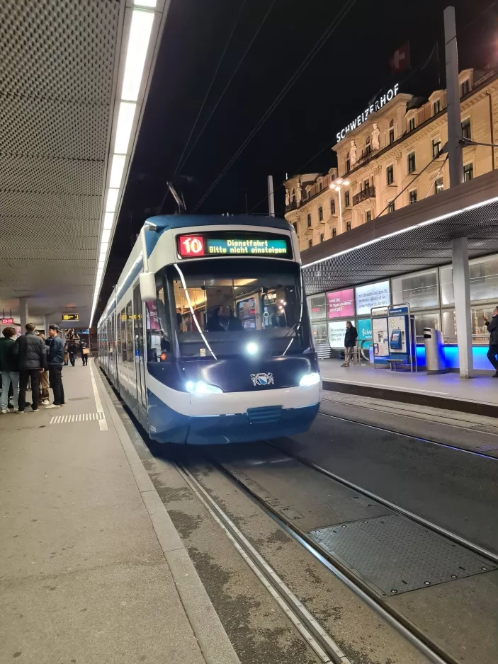 Zürich regional line 10 with low-floor articulated tram 3016 at Bahnhofplatz/HB (2022)
