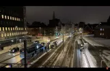 Trainspotting: Aarhus in Winter Skrud: The Light Rail Passes DOKK1 under Snow's Warm Cover ❄️🚊